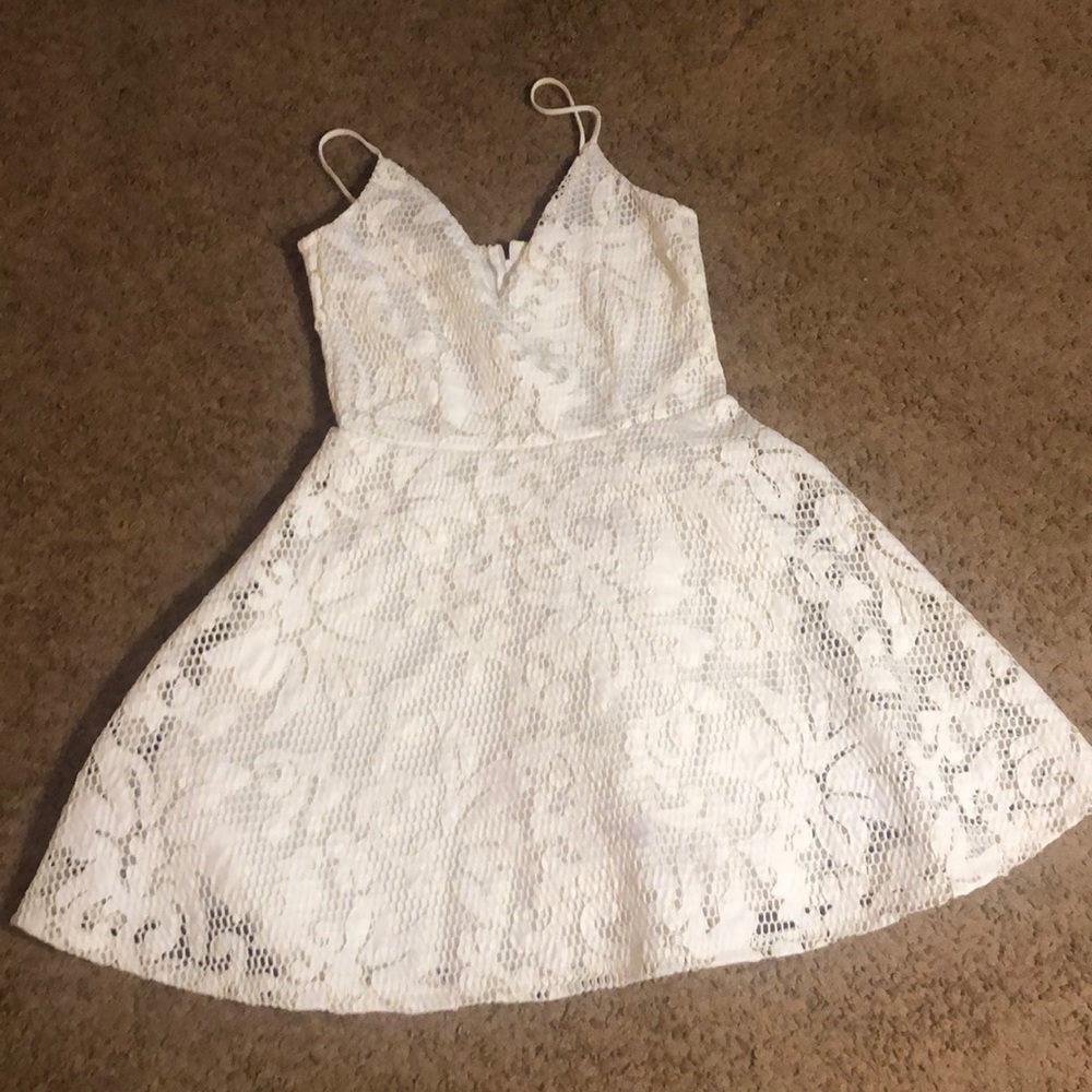 White dress with a flower like design